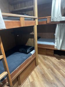 a couple of bunk beds in a room at Leigh Backpackers in Leigh