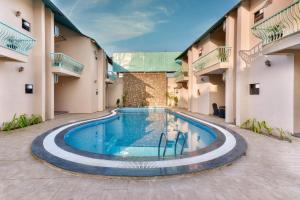a swimming pool in the middle of a building at The Bagh Villa Pench By Ficusroots Experience in Khawāsa