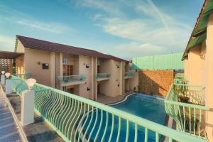 a view of a balcony with a swimming pool at The Bagh Villa Pench By Ficusroots Experience in Khawāsa
