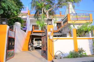 a yellow gate in front of a building at Vatika palace in Ayodhya