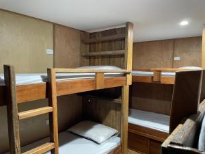 a group of bunk beds in a room at Leigh Backpackers in Leigh +11 photos