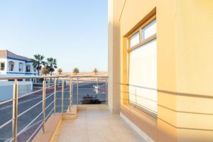 a balcony with a view of a street at Don Self Catering in Walvis Bay