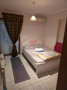 a bedroom with a bed and a window at Ariadni's Dreamhouse in Akrata