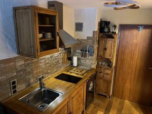 a kitchen with a sink and a counter top at stylish suite OldTown free parking Air Condition in Heidelberg