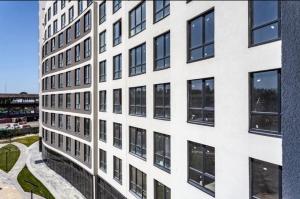 an exterior view of a white building at Апартаменти Парус Сіті in Lviv