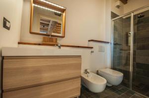 a bathroom with a sink and a toilet and a shower at B&B Le Grazie in Parma