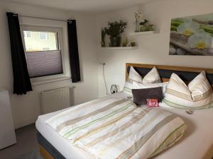 a large bed in a bedroom with a window at Apartment in der Au in Langkampfen