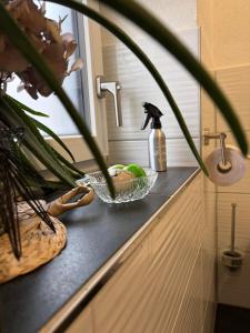 a kitchen counter with a sink with a bowl of food at Apartment in der Au in Langkampfen +30 photos