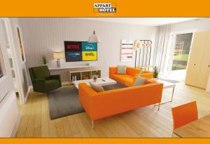 a living room with an orange couch and two chairs at APPART'HÔTEL Les Prés Blondeau, 1 à 10 personnes, 3 chambres, Terrasse, Parking privé, Wifi, Arrivée autonome 24-7 in Les Rosiers