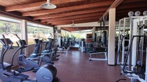 a gym with lots of treadms and cardio machines at Futura Club Le Cale d'Otranto in Otranto