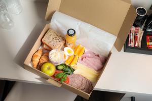 a box filled with different types of food at Yuko Residence in Jasło
