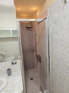 a shower with a glass door in a bathroom at Bis Jolly 1 in Cosenza +19 photos