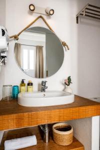 a bathroom with a sink and a mirror at Hotel Boutique Ses Penyes in Alaior +37 photos