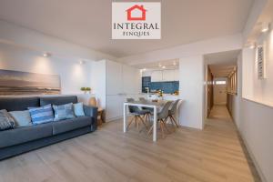 a living room with a couch and a table at Palamós Blue Holidays in Palamós