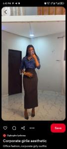 a woman taking a picture of herself in a mirror at Havvina property in Mama