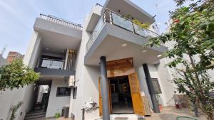 a building with a door in front of it at Hotel Shree Niwas Inn Near Airport in Jāmb