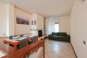 a living room with a table and a couch at Viewpoint House in Alzano Lombardo