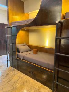a couple of bunk beds in a room at Mojo Hostel in Puerto Princesa City