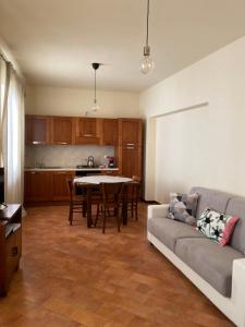 a living room with a couch and a table at Casa Rasiglia 3 House Relax in Casenove