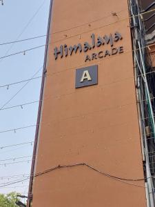a sign on the side of a building at Hotel Sun Lake in Ahmedabad