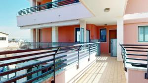 a balcony of a building with orange walls at Residence Magnolia in Grado