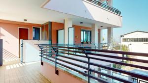 a balcony of a house with a railing at Residence Magnolia in Grado
