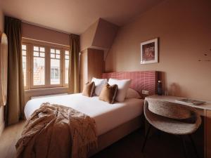 a hotel room with a bed and a window at Adam's Museum House in Amsterdam +40 photos