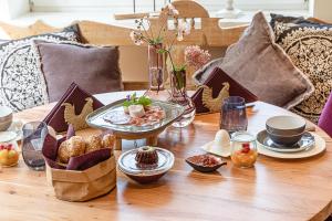 a wooden table with food on top of it at Zum Kirchenwirt in Anzing