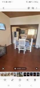 a view of a living room with a table and chairs at Rafa y Nelly 2 in San Clemente del Tuyú
