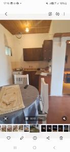 a room with a table and a kitchen with a tableablish at Rafa y Nelly 2 in San Clemente del Tuyú