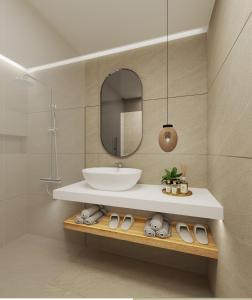 a bathroom with a sink and a mirror at Agali Hotel Milos in Adamantas +6 photos