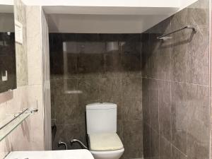 a bathroom with a toilet and a sink at Sylvan Crest Ella in Ella +15 photos