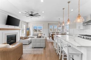 a kitchen and living room with a fireplace at 921 Asbury Ave, Unit C in Ocean City