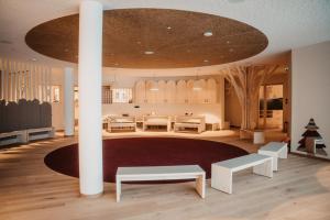 a rendering of a room with a large ceiling at Hotel Neubergerhof in Filzmoos