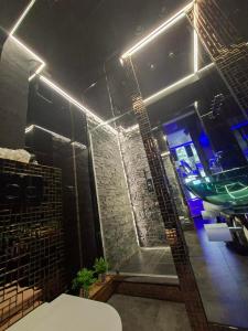 a bathroom with a shower and a sink in a room at SECRET LOVE studio in Ełk