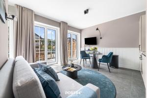 a living room with a couch and a table at Ferienwohnung TheViewB17 Boje 17 Dagebüll in Dagebüll +17 photos