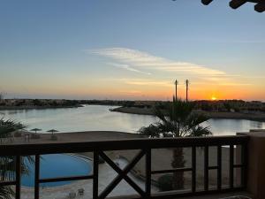 a view of a river at sunset from a balcony at Blue haven el gouna in Hurghada