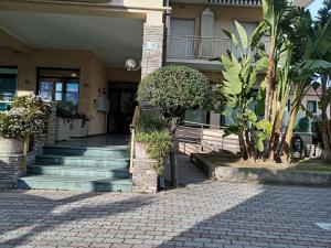 a building with a staircase leading to a building at Colibrì in Bordighera