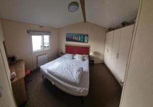 a bedroom with a large bed in a room at Spacious accomodation 188 Unity Beach sleeps 6 Centrally located Pet friendly Pets Stay Free in Brean +47 photos