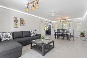 a living room with a couch and a table at 9 Montego Bay Caribbean Estates in Port Edward