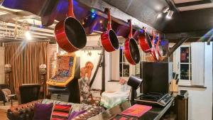 a room with pots and pans hanging from the ceiling at Riverside Lodge Self-Catering Apartment in Peterborough