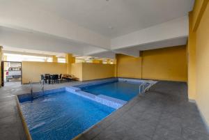 a large swimming pool in a room with at The Zenith Palace in Lekki