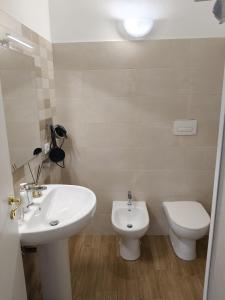 a bathroom with a sink and a toilet at JeD SWEET DREAMS in LʼAquila +22 photos
