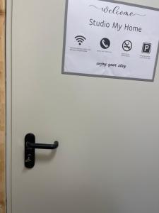 a door with a welcome sign on it at Studio My Home in Brig +3 photos