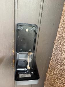 a pay phone in a metal box on a door at Studio My Home in Brig