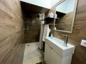 a bathroom with a white sink and a shower at Apartment am Roten Stein in Erfurt +10 photos