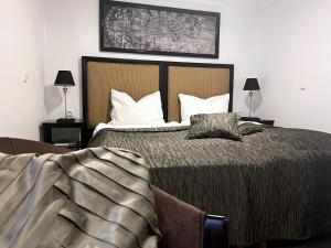 a bedroom with a large bed with white pillows at Apartment am Roten Stein in Erfurt