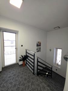 a living room with a bed and a window at Pokoje Sandra I in Łeba