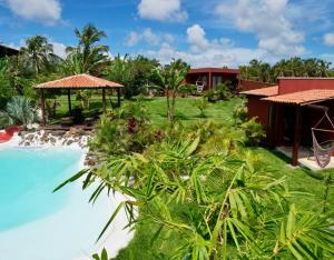 an image of a resort with a swimming pool at Kitesurf Oasis Maracajaú in Maracajaú
