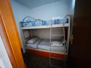 a small room with two bunk beds in it at Casa Stella Marina in Anzio